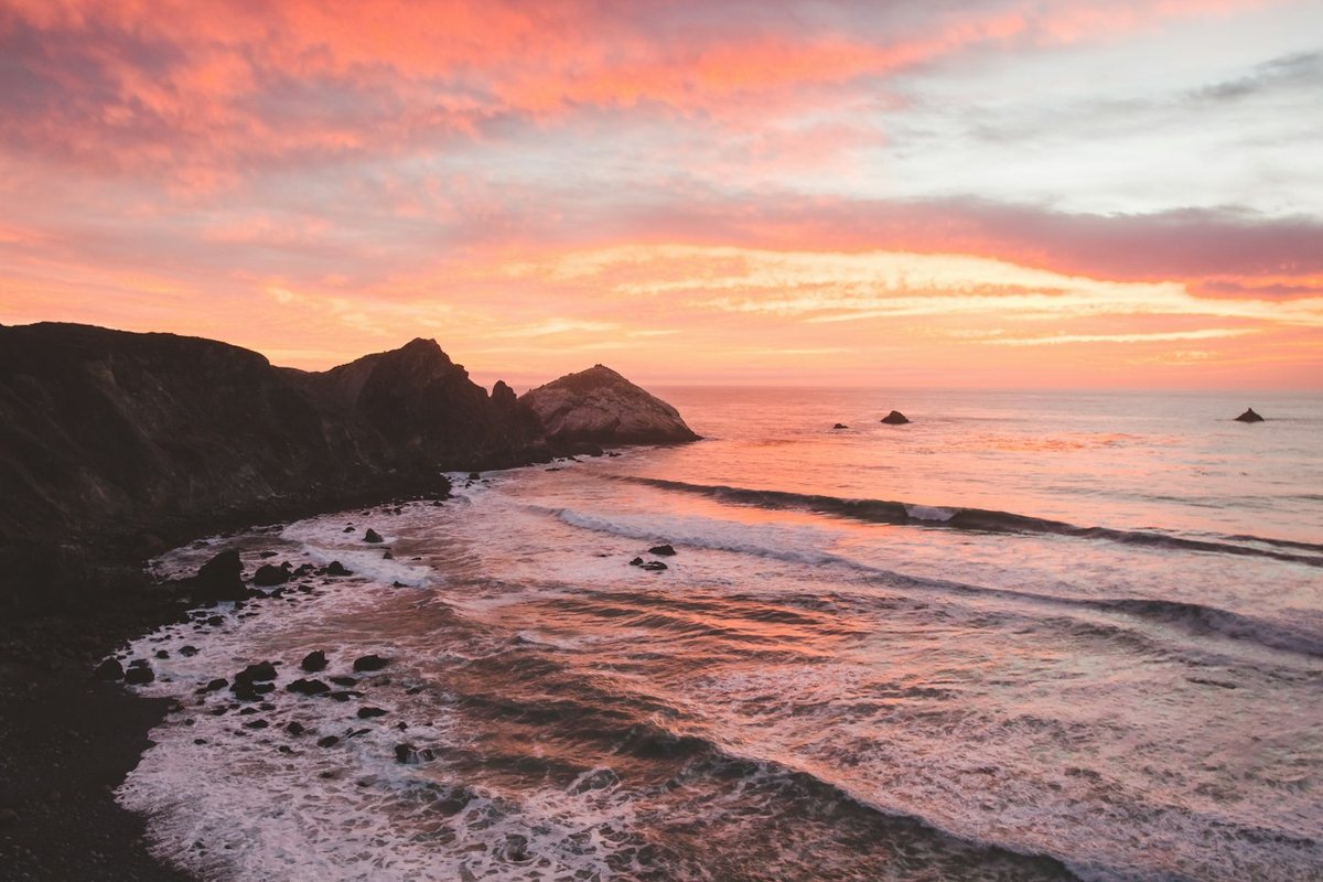 a beach with rocks and water