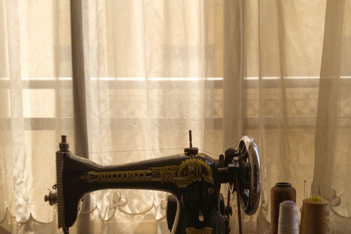 a sewing machine sitting on top of a wooden table